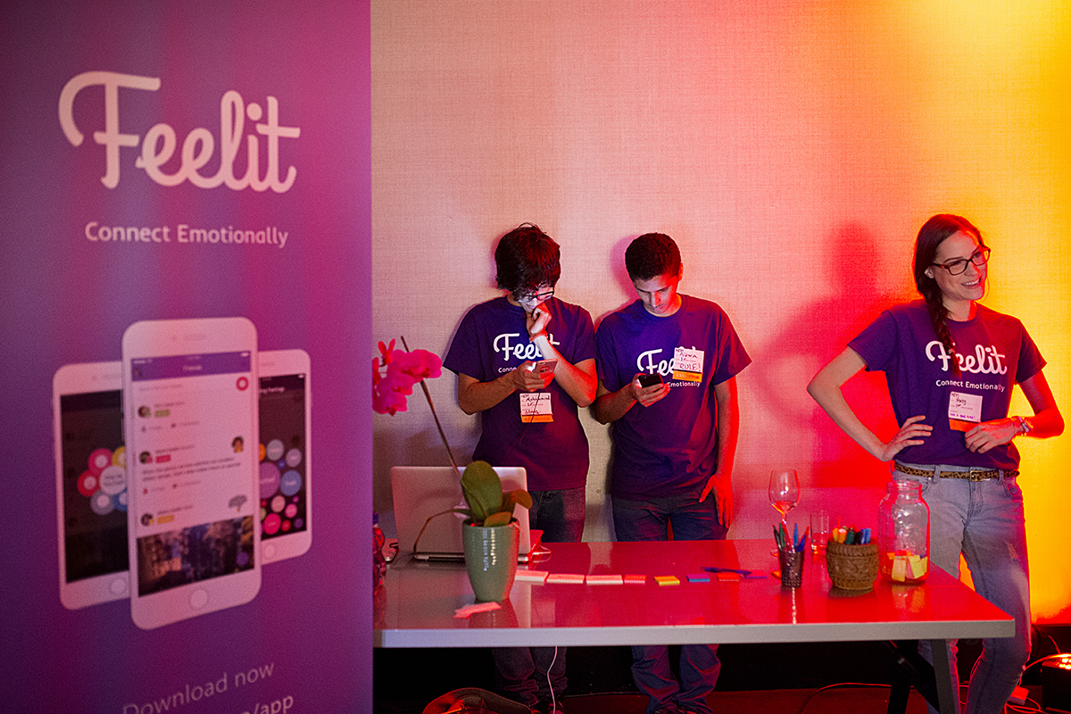 Mohammed Alkadi, Albara Hakami and Abby Wischnia (left to right) host a booth for their company Feelit, a social app to help people express their feelings and emotions, during the Startup and Tech Mixer at the W Hotel in San Francisco, Calif., on Friday, March 27, 2015. The networking event, which draws hundreds of people from the tech industry, is held every few months.