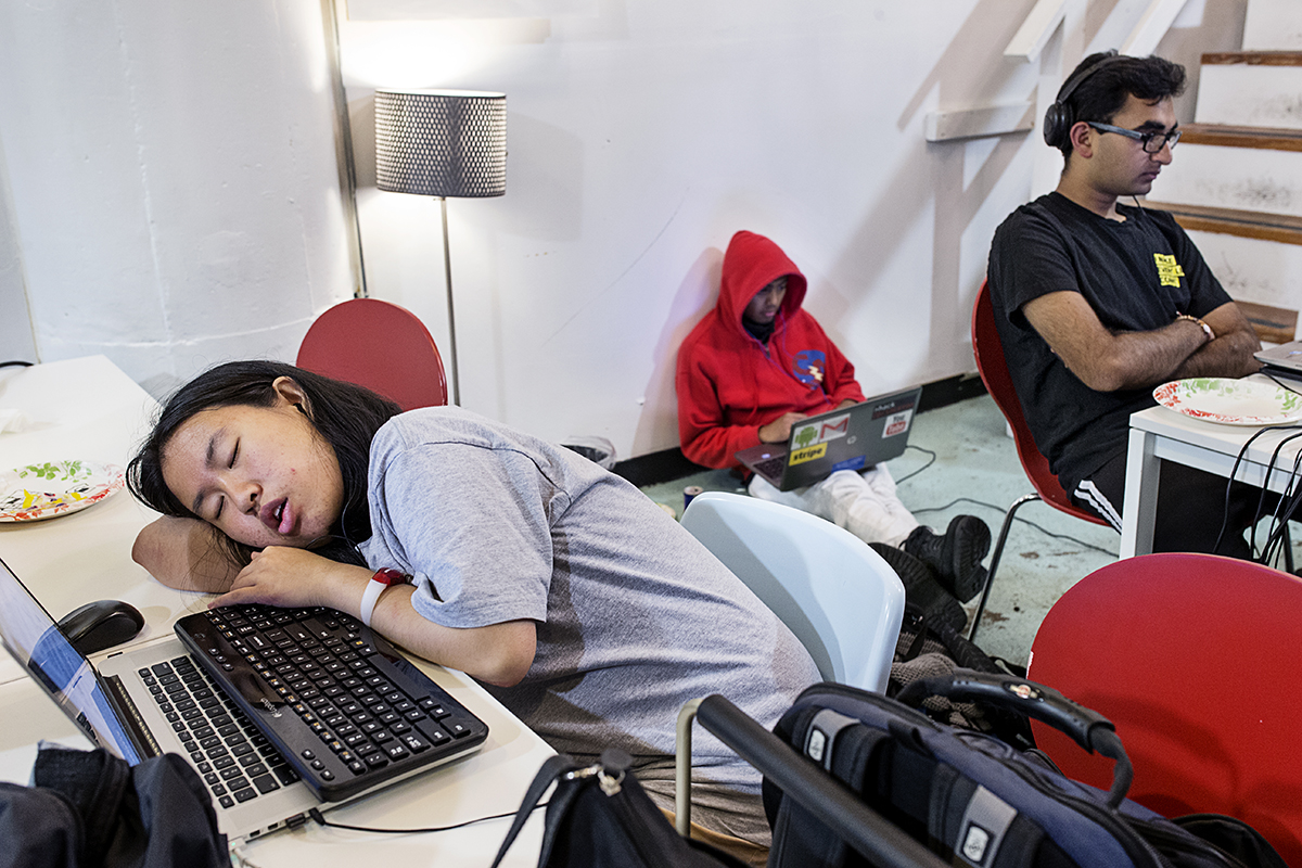 A participant in a hackathon organized by the company Shirts.io sleeps at her computer during the event at Citizen Space in San Francsico, Calif., on Saturday, August 16, 2014. Hackathons are events usually lasting a few days in which computer programmers and others involved in software and hardware development collaborate on a project over a set period of time, often while competing for awards and prizes. This hackathon lasted 37 hours and many participants stayed the entire time, taking breaks to sleep where and when they could.  