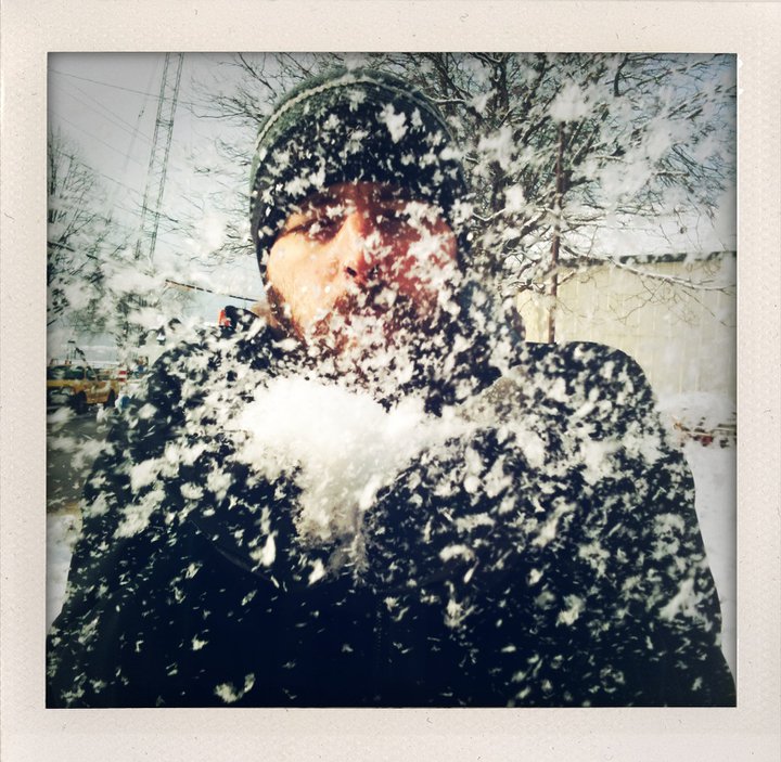 Vermont photographer Judd Lamphere blows snow into the camera in Burlington.