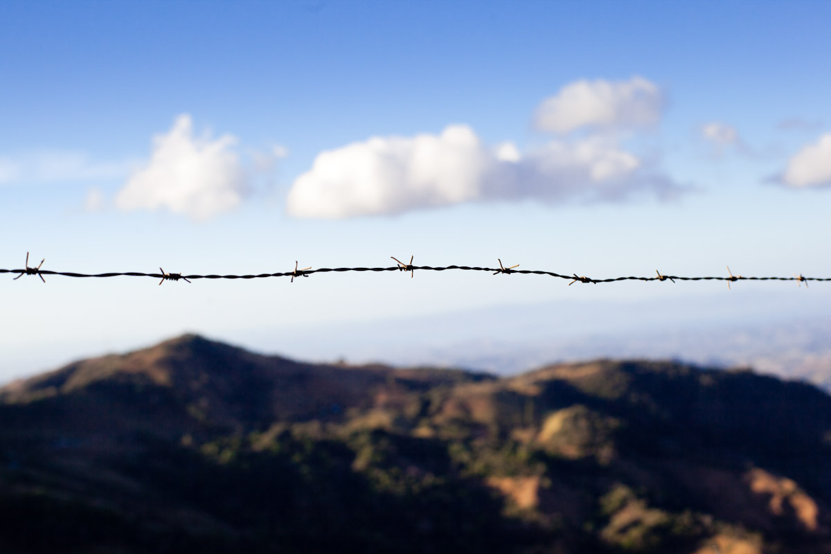 Barbed wire cuts across the landscape, just outside Monteverde, Costa Rica.