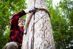 Martin Hemming log climbing while participating in the annual Adirondack Woodsmen\'s School at Paul Smith\'s College. by Monica Donovan for the Sunday Times