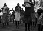 Children of South Sudanese refugees, who fled their country because of war, entertain themselves with a dance called {quote}Daluka.{quote} In response to fighting which broke out in South Sudan, in December 2013, thousands of South Sudanese refugees crossed the border at Nimule into northern Uganda.  