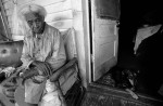 An elder relaxes on her porch in an all-black municipality founded by ex-slaves in 1887.