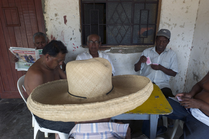 Several Afro-Peruvian men relax over a game of cards in the northern region near Ecuador.