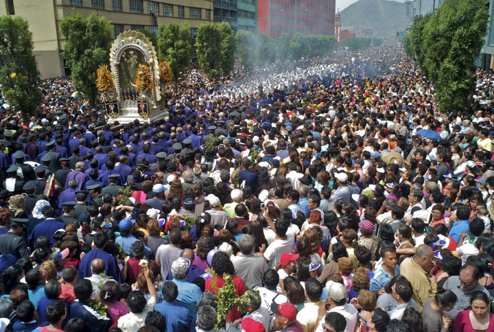 Thousands of Peruvians gather at an outdoor mass and procession in honor of Our Lord of Miracles (Senor de los Milagros). It's the country's most widely attended religious event.It is rooted in African culture. According to tradition, in 1651 an enslaved man from Angola, who had converted to Catholicism, painted the depiction of Christ crucified on the wall of a building in Lima. In 1655 a major earthquake hit the area destroying the building, but the wall adorned with the painting was unharmed. Another earthquake, in 1687, caused the building to collapse and again the wall with the painted image remained intact. This cemented the importance of the image to the faithful. A replica of the image (with the Virgin Mary on one side) was created and is taken out in procession through the streets of Peru annually. The veneration of the image has international as well as national significance and it is associated with miraculous incidents.