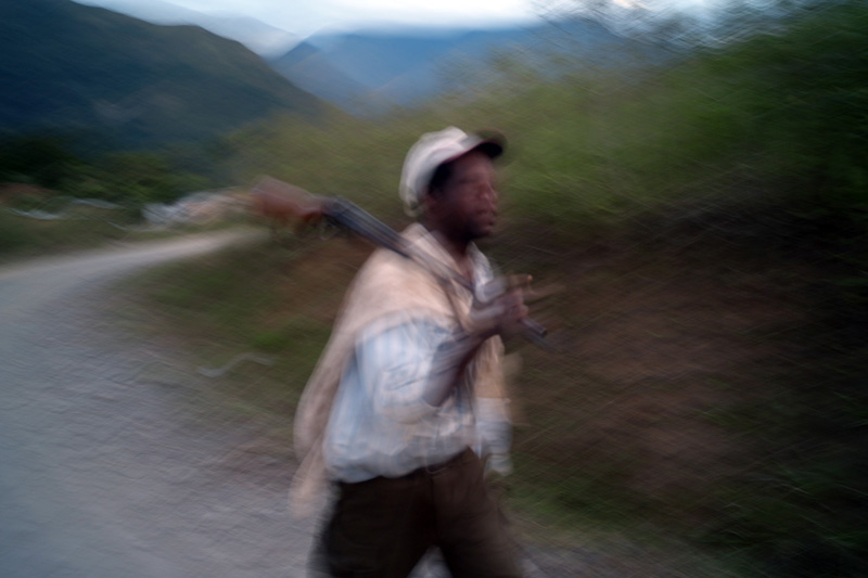 An Afro-Bolivian hunter returns home at the end of the day in the lush Yungas Valley.