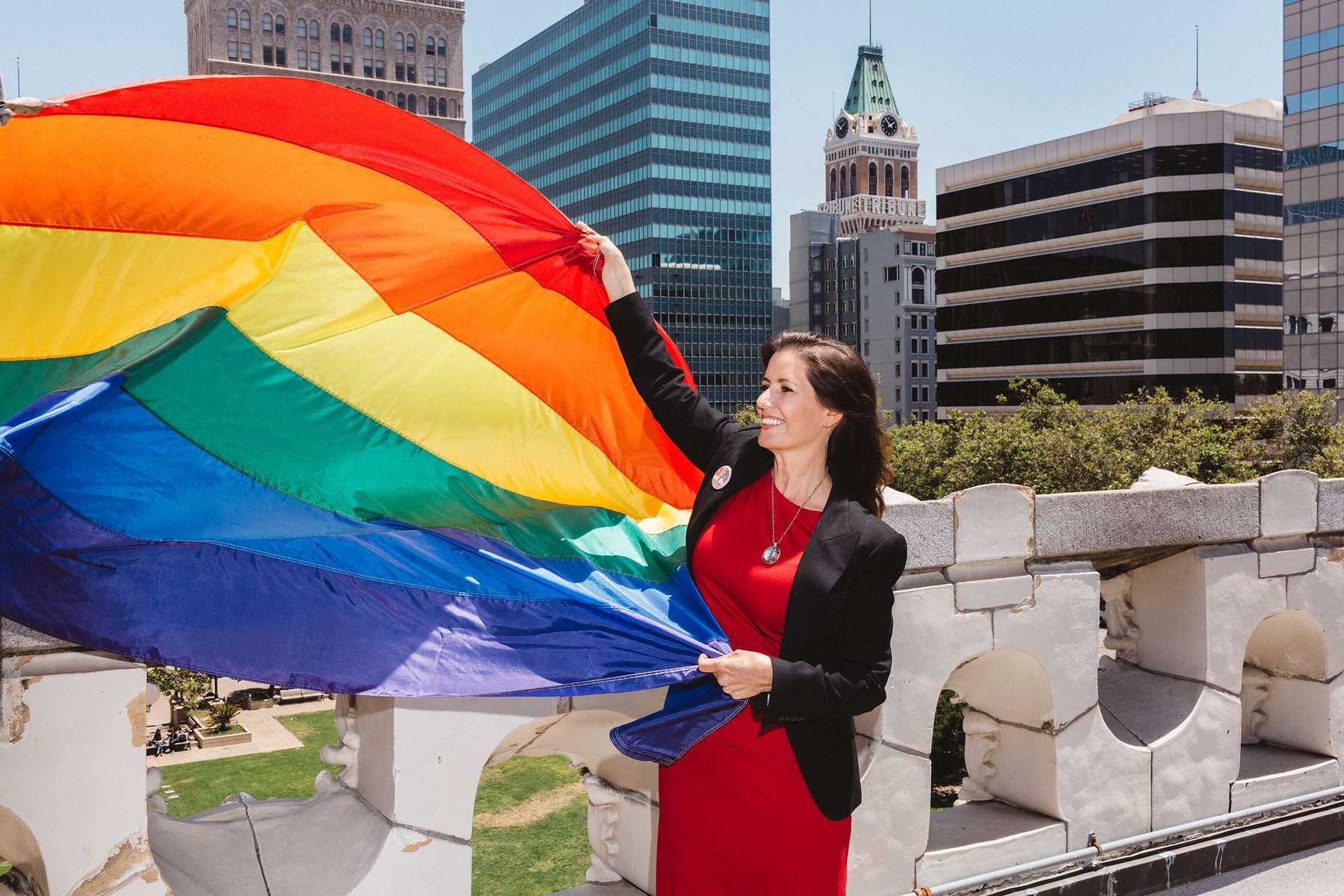Oakland Mayor Libby Schaaf helps dedicate and raise a flag in honor of Gay Pride on top of City Hall on Thursday, June 22, 2017 in Oakland, Calif.