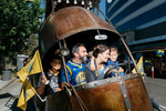 Oakland Mayor Libby Schaaf sits in 'The Golden Mean' snail art car with her husband, Sal (Salvatore) Fahey and children, Dominic, far left, and Lena before the start of the Warriors Championship parade on June 15, 2017.