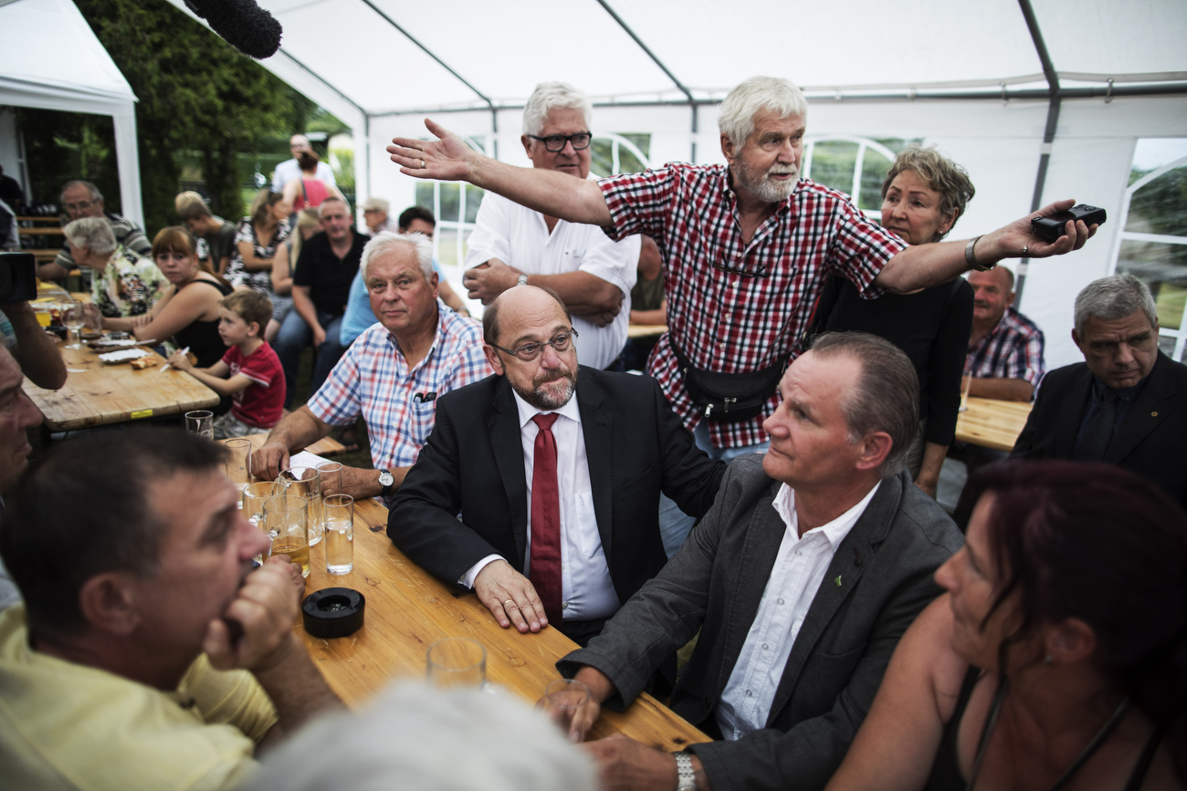August 08, 2017 - Landsberg, Germany: : SPD party candidate for chancellor Martin Schulz speaks at „Am Pfarrberg e.V.“ allotment with citizens angry on the coalitions migration policies. (Hermann Bredehorst / Der Spiegel / Polaris)