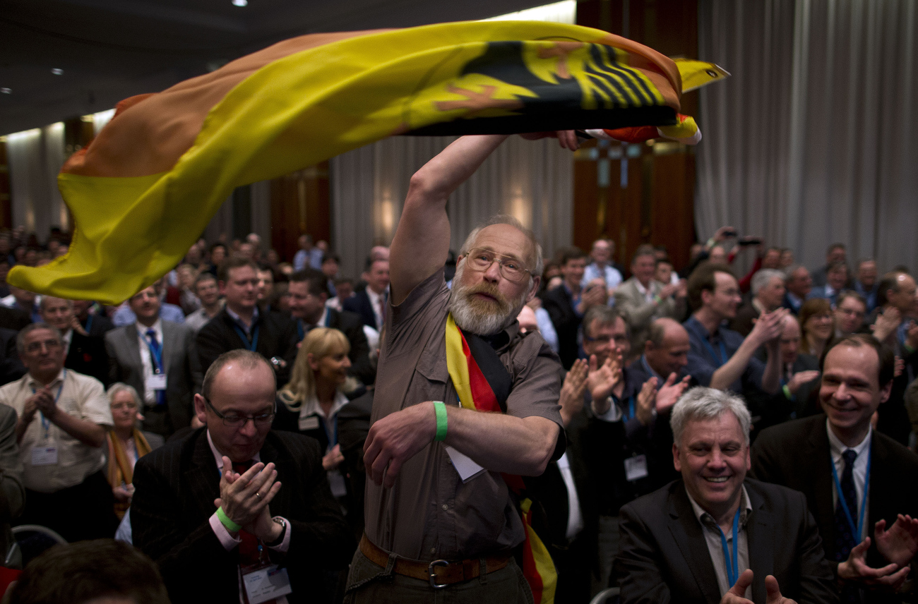 April 14, 2013 - Berlin, Berlin, Germany: Mr. Viktor Kasper  from Hannover, an immigrant from Russia,  applauds as Bernd Lucke, co-founder of Germany's anti-euro party AfD 'Alternative fuer Deutschland' (Alternative for Germany) speaks from a podium during the founding convention of Germany's anti-euro party AfD 'Alternative fuer Deutschland'. AfD is a euro-skeptical, conservative party.  Recent polls show that about a quarter of the German electorate may consider voting for a party that advocates a German exit from the eurozone. General elections in Germany are scheduled for Sept. 22 