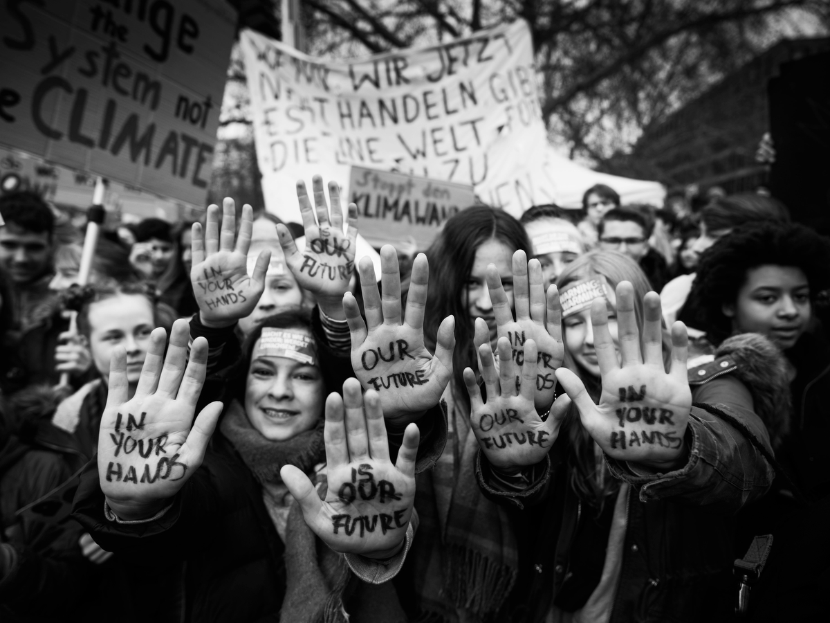  Berlin, Germany: Children and students hold up their hands inscribed with: 'In your hands is our future' as they participate in a FridaysForFuture climate protest march.According to organizers striking students took to the streets today in 220 cities and towns across Germany to protest for policies to avert further climate change, with 25,000 people taking part in the protest in Berlin. Worldwide student protests are expected in over 1,000 cities. The worldwide protests were inspired by Swedish teen activist Greta Thunberg, who camped out in front of parliament in Stockholm last year to demand action from world leaders on global warming. 
