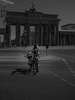 April 17, 2020 - Berlin, Germany:  A woman wears a face mask as she pushes a bike in front of the Brandenburg Gate during the coronavirus pandemic. Usually this is on Friday afternoons a high traffic area. As the rate of new infections nationwide continues to slow, the German government is seeking to establish and implement a roadmap for easing restrictions on public life and the impact  the virus is having on the economy. So far there are over 130,000 cases of confirmed infections of Covid 19 in Germany, over 3,000 people have died and about 57,000 people recovered. (Hermann Bredehorst / Polaris)April 17, 2020 - Berlin, Germany:  A woman wears a face mask as she pushes a bike iin front of the Brandenburg Gate during the coronavirus pandemic. Usually this is on Friday afternoons a high traffic area. As the rate of new infections nationwide continues to slow, the German government is seeking to establish and implement a roadmap for easing restrictions on public life and the impact  the virus is having on the economy. So far there are over 130,000 cases of confirmed infections of Covid 19 in Germany, over 3,000 people have died and about 57,000 people recovered. 
