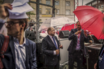 August 31, 2017 - Kiel: Martin Schulz (C), Social Democrat Party (SPD) leader and SPD party candidate for German Chancellor, holds an umbrella during a heavy rain shower as he stands beside the stage after finishing his speech  to supporters during an election campaign rally under the motto; „Martin Schulz live“ . Left: Adviser and speechwriter of Martin Schulz, Jonas Hirschnitz covers himself with papers from the rainfall as another adviser protects himself and Schulz on the right. (Hermann Bredehorst / Der Spiegel / Polaris)