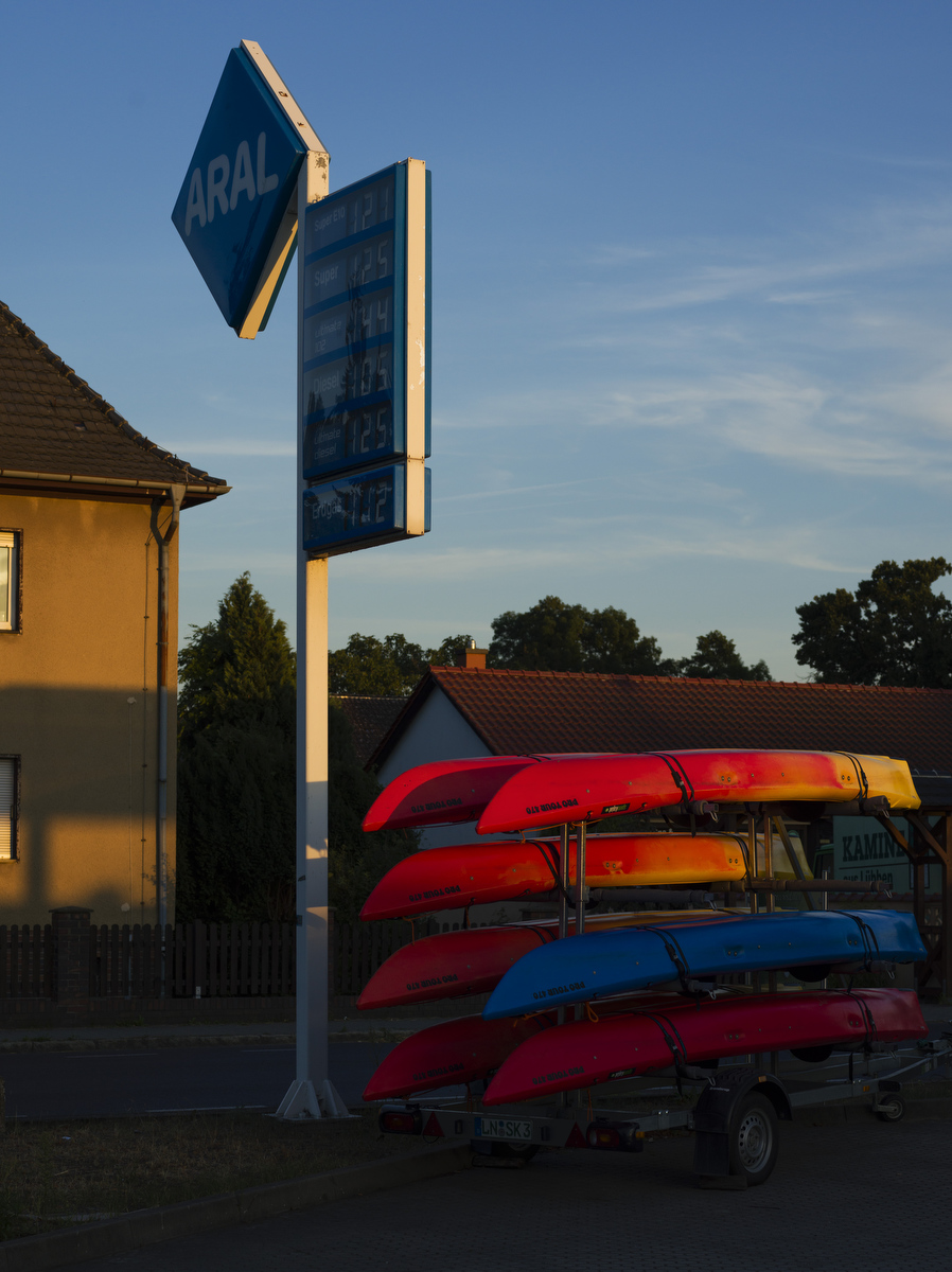  Germany, Brandenburg, Lübben: Rental canoes at a gas station