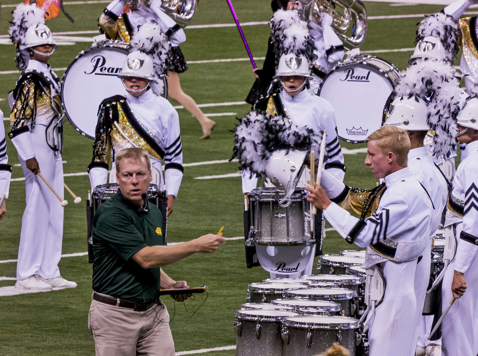 Drum Judge hands back the shanko of a drummer from Phantom Regiment at the 2015 DCI Finals at Lucs Oil Stadium. Photo by ronwyattphotos.com