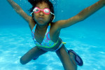 Seven year old Kassandra Marks from Harlem bets she can hold her breath all summer in Central Park's Lasker Pool