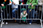  A young spectator looked downt 5th Avenue as the 250th Annual St. Patrick's Day Parade kicked off 