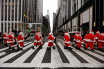 Volunteers of America's 107th Annual Sidewalk Santa Parade took 50 Santa volunteers down 5th Avenue 