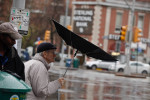 New Yorkers braved the bad weather walking through the rain in Forest Hills, Queens 