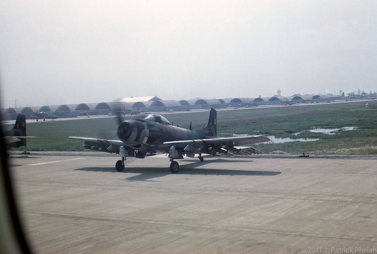 Bien Hoa Air Base with VNAF T-28 Trojan bombers waiting to taxi.