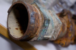 A corroded pipe, one of many commonly found in community drinking water systems throughout the Central Valley. 