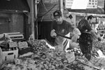 The Fish Market in Washington DC, down by the SW waterfront has been a mainstay in the city for decades. Soon, it is slated to undergo significant renovations. On a typical Saturday morning at the market, fishmongers who have worked there for decades, such as Patrick (pictured here), prepare for their first customers.