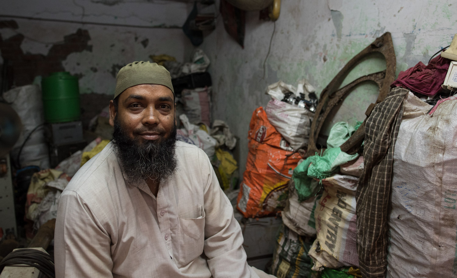 Farook Ahmed, an iron and wiring expert, has been dismantling electronics for 15 years, and he hopes to pass his business to his toddler son.