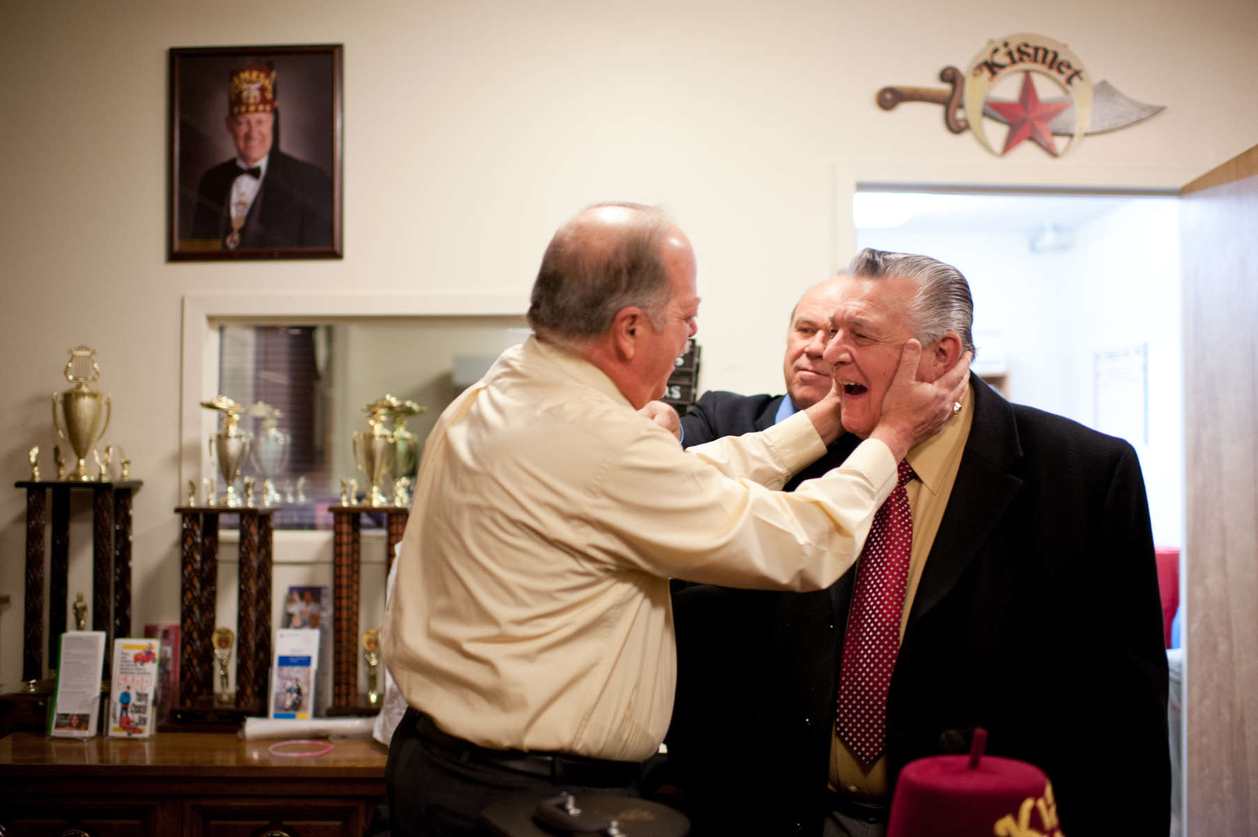 Noble Michael Finocchio, 65, of North Patchogue greets friend and Shriner brother Noble Joe Rizzo, 71, of Sayville, before a meeting of the Kismet Shriners in Hicksville. (Mar. 5, 2012) (Photo by Nancy Borowick)