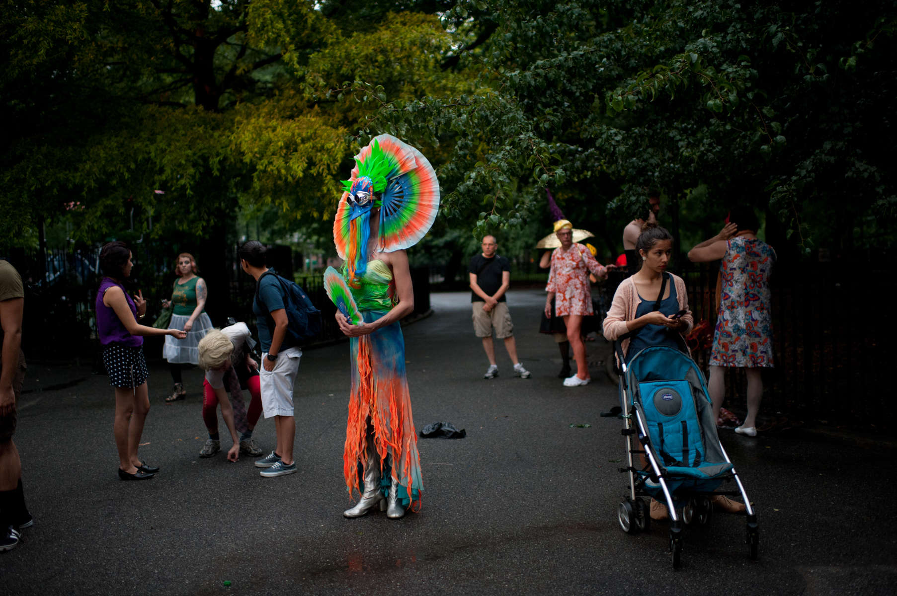 Friends congregate at Tompkins Square Park in the East Village in festive attire before heading to the Stonewall Inn in the West Village during the New York City Drag March.