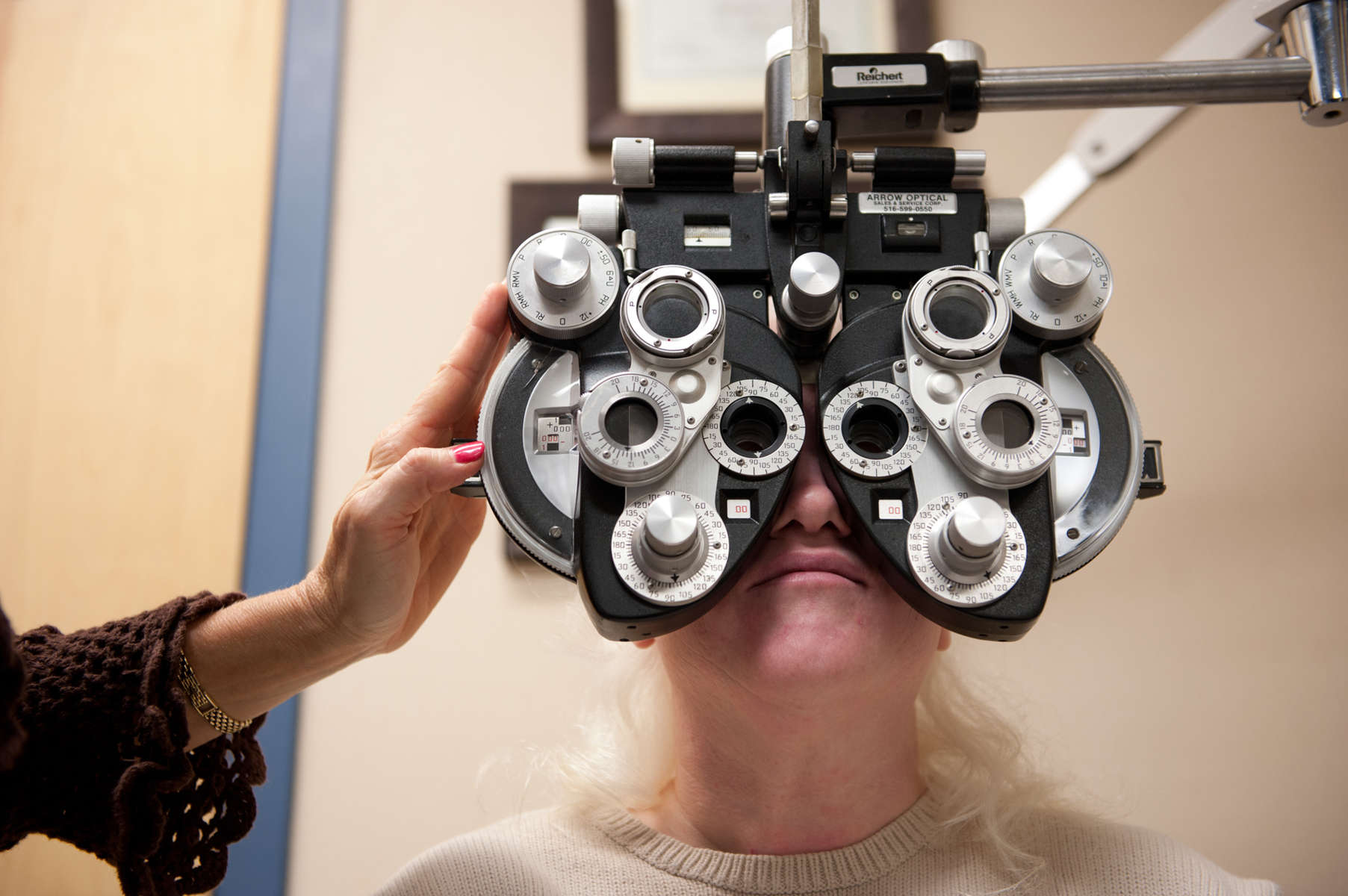 Dr. Gwen Gnadt uses a Phoropter on patient Cindy Fagan to determine the proper eyeglass prescription for her during an eye exam at Eye Vision Associates in Lake Ronkonkoma. (Mar. 1, 2012) Photo by Nancy Borowick
