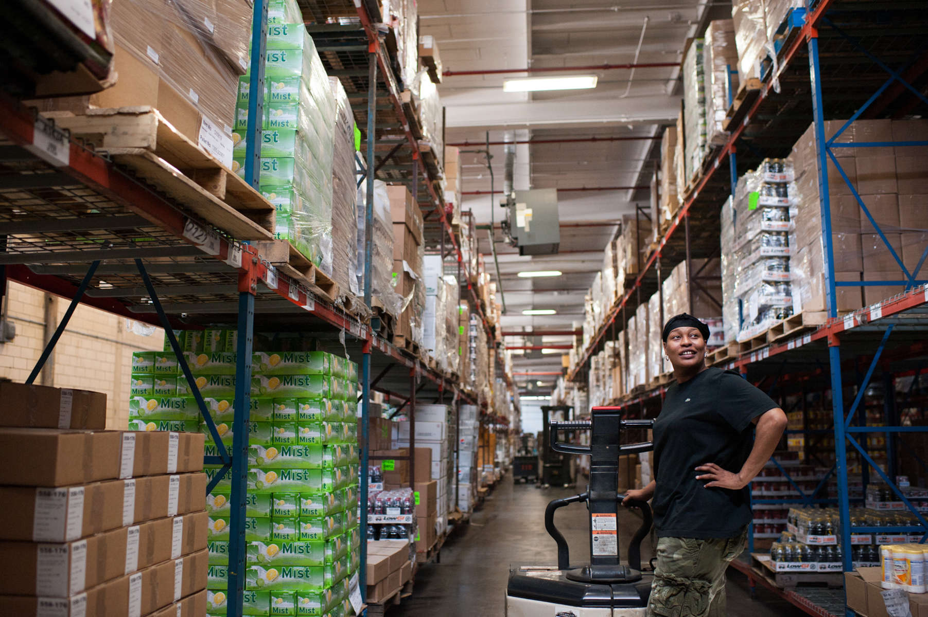 The Community Food Bank of New Jersey is a 285,000 square foot facility located in Hillsdale, New Jersey. Employees of the food bank buzz around the space, moving and organizing items. (May 13, 2014)Photo by Nancy Borowick