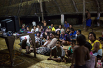 The community gathers for a movie night at the Maneaba (meeting house), Taburao Village, Abaiang Island, Kiribati.