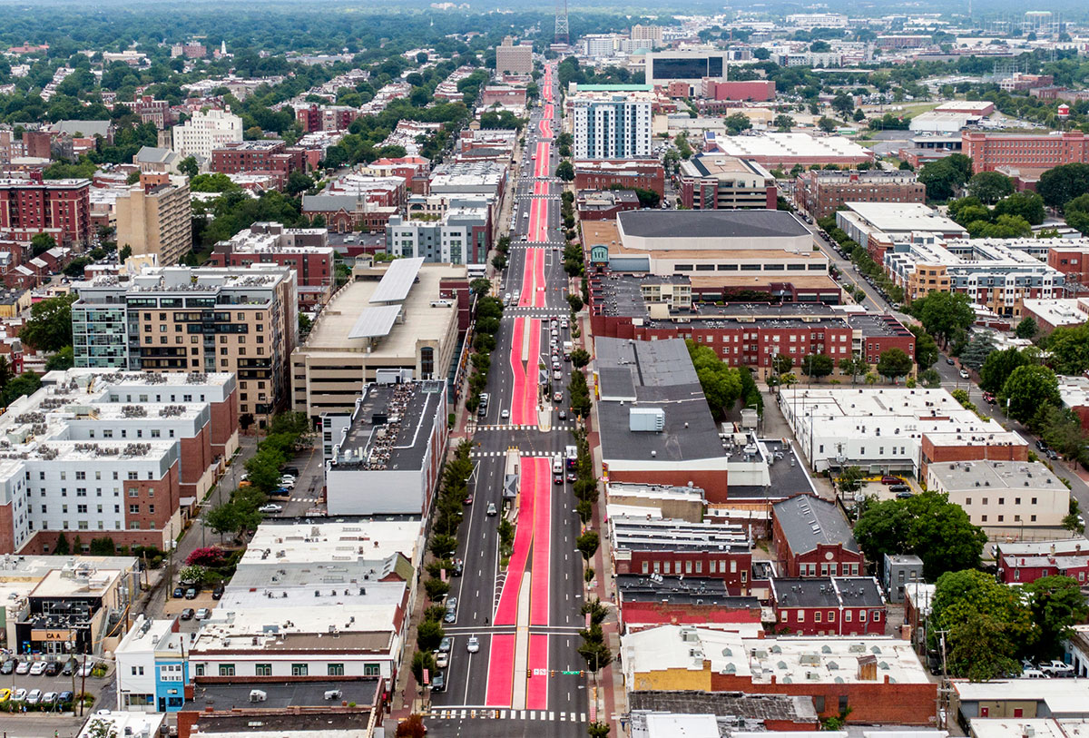 Broad Street is coated with red paint as Greater Richmond Transit Company's Pulse bus gets new 2.5-mile bus-only symbol in Richmond, Virginia.