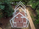 {quote}Historic Polegreen Church is known as the cradle of religious freedom,{quote} Leslie Luck, shown in this drone photo and Director of Operations of Historic Polegreen Church Foundation, said of the church site on Tuesday, August 16, 2022. Samuel Davies, who inspired a young Patrick Henry, was Virginia's first licensed non-Anglican minister there from 1748 to 1759. The original church structure was burned down during the Civil War, and the current white steel beam structure, designed by Carlton Abbott, was erected at the site. Other than the historical importance and symbolism for religious freedom, the Historic Polegreen Church located in Hanover County, is a popular wedding venue, and was made even more popular since guitarist, singer and songwriter Jason Mraz got married here.