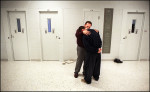 Jack Smith, chaplain of Southeastern Correctional Ministry, comforts and prays with a teenage resident at Middle Peninsula Juvenile Detention Center. For 20 years, the ministry has reached out to those in jails on and around the Peninsula. 