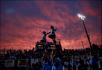 Hanover High School cheerleaders perform with sunset as tropical storm Hermine approach the area. 