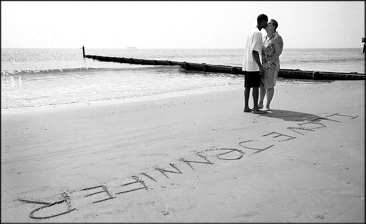 Jennifer and her boyfriend, Ben, share a quiet moment at the beach after Ben wrote, 'I love Jennifer.' Despite the court order to stay away from Ben after they had a fight, Jennifer keeps her relationship.