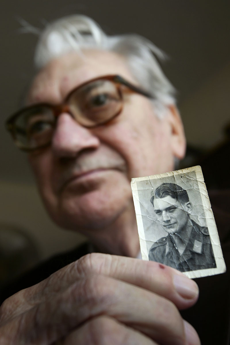 Hans Blume shows his photo from 1944 at his home in Hampton. Blume was an 18-year-old private in the German Luftwaffe during WWII. He recalls the Battle of the Bulge from the German perspective on the anniversary of the day Germany launched its last major offensive against the Allies. Some sources consider it the bloodiest battle of the war for U.S. troops.  