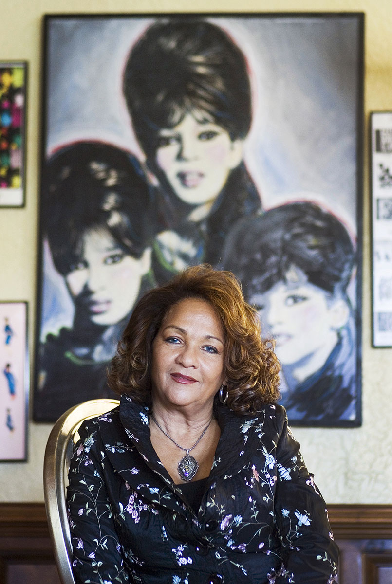 Nedra Ross is a member of The Ronettes, girl group of the 1960s and sang, {quote}Be My Baby,{quote} which has been described as the {quote}Record of the Century.{quote} She is shown in front of the painting of The Ronettes. As part of the Ronettes, Nedra Ross was inducted into the Rock and Roll Hall of Fame in 2007.