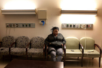 Lawanda Booker waits as her son, Edward Miller, goes through 13-hour spinal fusion surgery to treat his curved spine at Shriners Hospitals for Children in Philadelphia. As Booker has to take care of Edward's medical issues and other needs, she has to stop working her job as a taxi driver, which caused difficult financial issues for the family. 