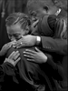 Shaqwanna Boisseau, facing, comforts her cousin, Kalesha Jones, 11, best friend of Amiya Moses, during a vigil. Amiya, the 12-year-old, was killed at her friend's apartment by a random shooting. 