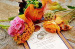 close-up-wedding-rings-on-invitation