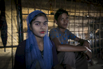 Tasmina Begum, 16, and Mohammad Eliyas, 18, pose for a photo in Cox's Bazar, Bangladesh. They married in a Bangladesh refugee camp 4 days ago. They fled after the August 25th attack when the military came to their village, burning houses and raping women. Eliyas says 'My parents are very old and have no one to take care of them and have no one to cook for them, so they decided I should get married. I'm a man, how can I cook? It was my parents decision that I should marry her, it's no problem that she's young. I have to do what my parents say.' Tasmina says, 'My father wanted me to get married so I couldn't say no.' 