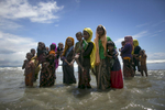 Rohingya are seen after arriving on a boat to Bangladesh 