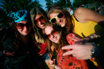 (L-R) Olivia Jackson, 20, Kim Shaw, 19, Vanessa Worthington, 20, and Alexa Rama, 18, stand for a picture during the Heros of Woodstock concert at the Bethel Woods Center for the Arts near the site of the original Woodstock Music Festival in Bethel, New York August 15, 2009. The concerts marks the 40th anniversary of the 1969 Woodstock music festival.