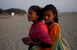 12 year old Shobe Majaraz hugs 12 year old Suma on the beach February 23, 2015.