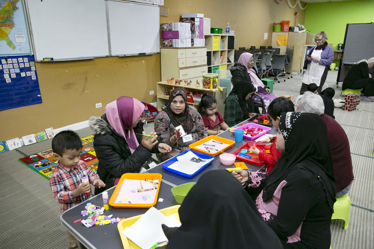 Rohingya women, children and volunteers participate in a {quote}Mommy and Me{quote} class at the Rohingya Cultural Center of Chicago on January 10, 2019 in Chicago, Illinois. The Mommy and Me class teaches children structured play, mothers how to bond with their children and prepare them for school.