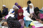Children participate in a Koran class at the Rohingya Cultural Center of Chicago 