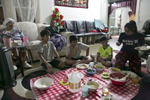 The Shukor family eats dinner on January 12, 2019 in Chicago, Illinois. The Shukor family arrived in Chicago in 2014 from Malaysia. Mohammad Shukor fled Myanmar in 1978 after the military shot him and arrested his father, who died in jail. He fled to Thailand by boat and spent 5 years there before making his way to Malaysia with his family. In Malaysia he and his family were denied an education, had to work illegally, and were frequently arrested and harassed by authorities. When he and his family were resettled in the US he says he {quote}felt so happy to finally have a country, to finally have a place to call home{quote}. 