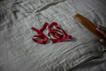 Hair ribbons lie on a pillow as girls prepare for school at the Veerni Institute  